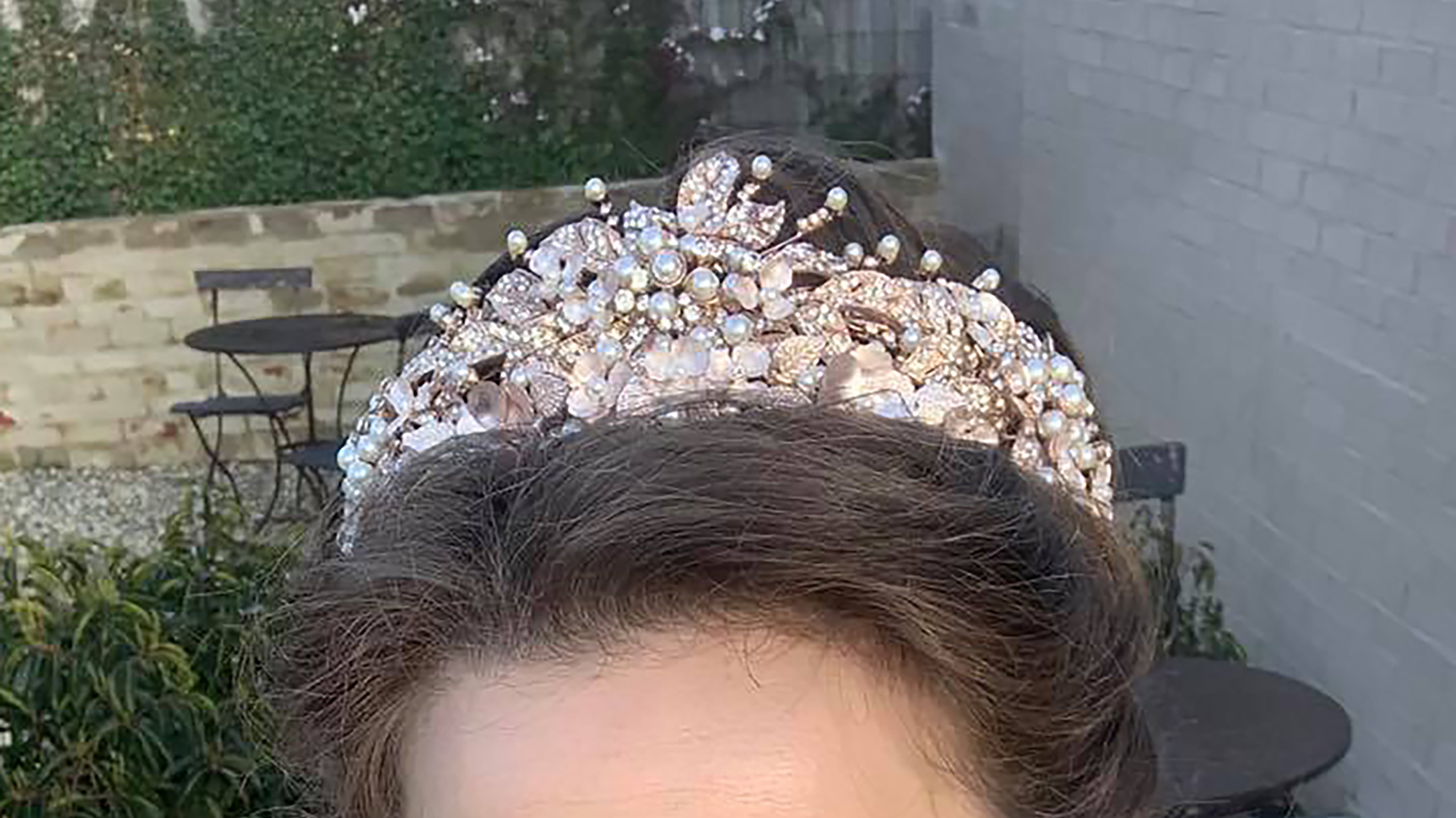 Bride with brown hair wearing pink crown