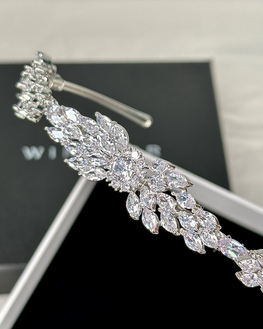Close up of a modern bridal look headband in silver crystal