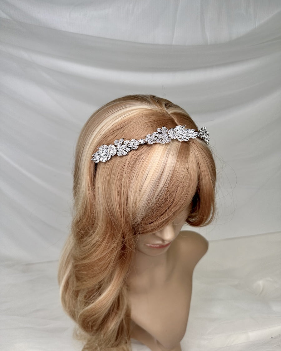 A thin style narrow bridal headband Loxley silver shown on a model head