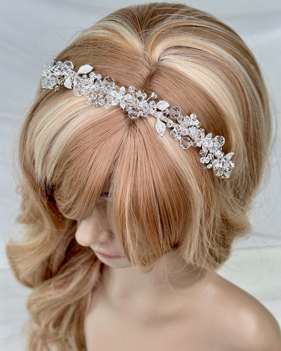 Faith Silver Crystal headband a modern bridal headpiece worn by a model head