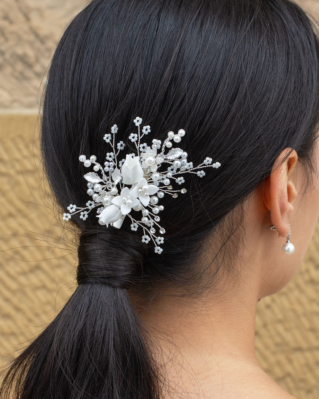 Kiara Silver Bridal Clip worn on a dark haired model