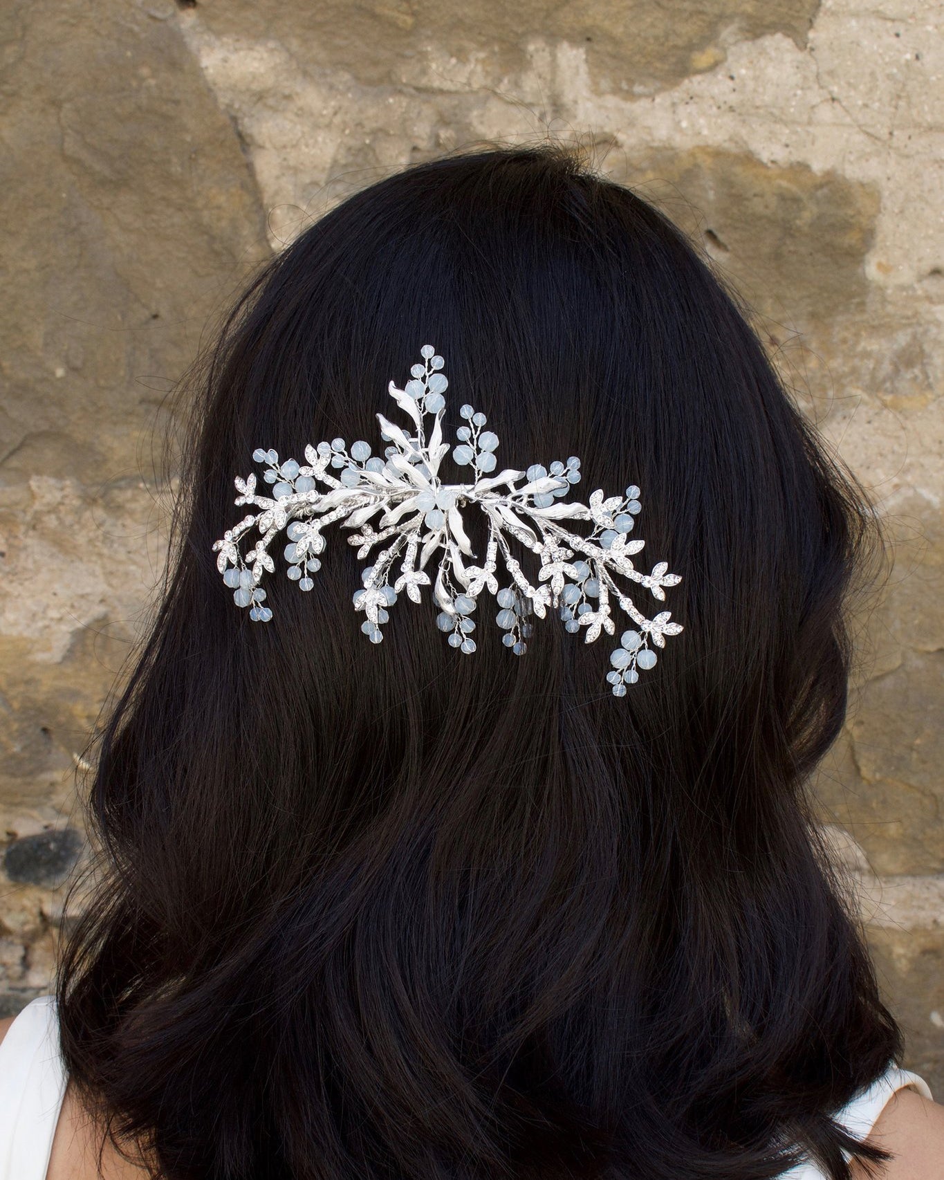 Silver Bridal Side Comb with Swarovski White Opal beads shown on a popular bridal hairstyle