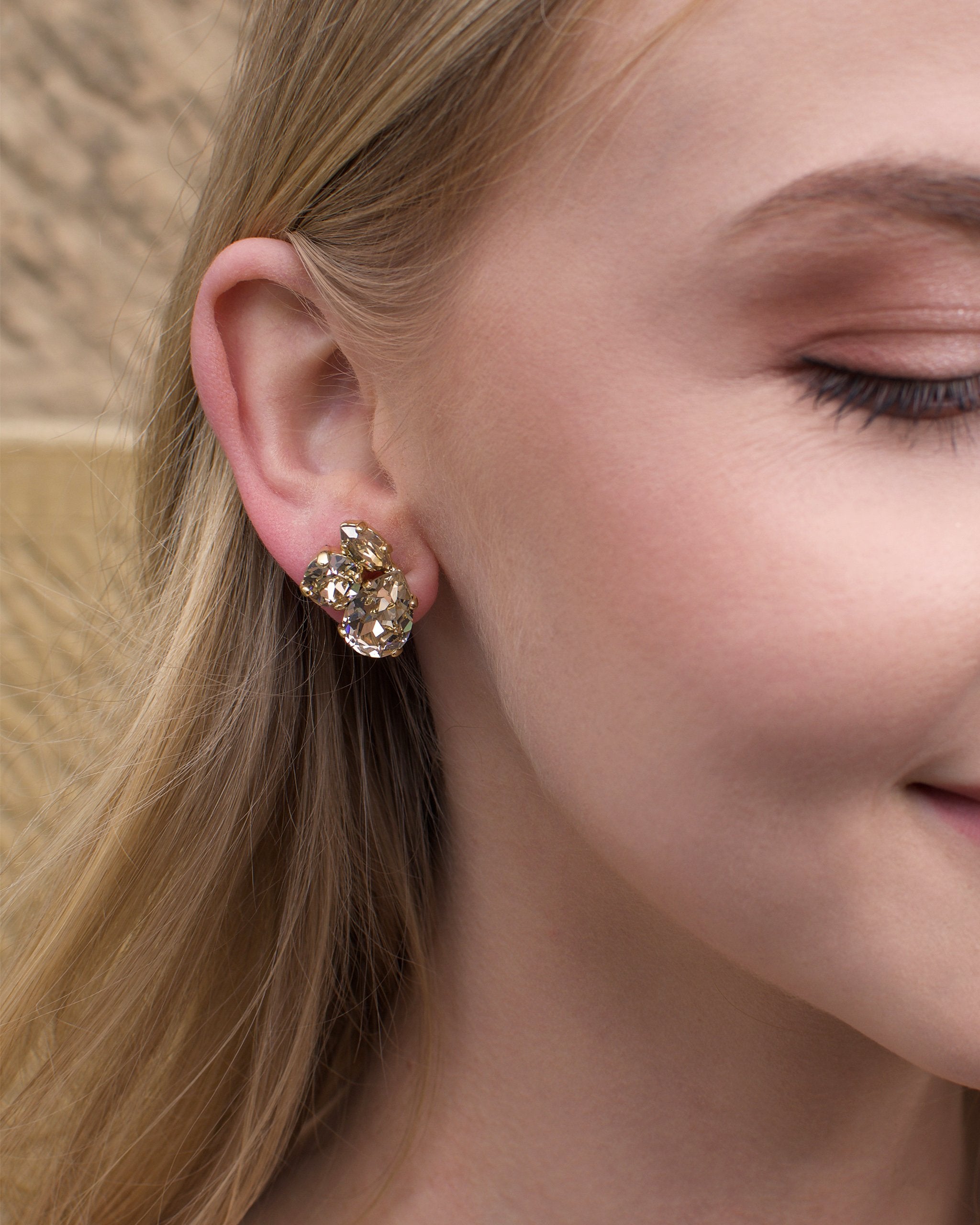 Swarovski Silk Colour stones in a hand made gold earring worn by a blonde bride