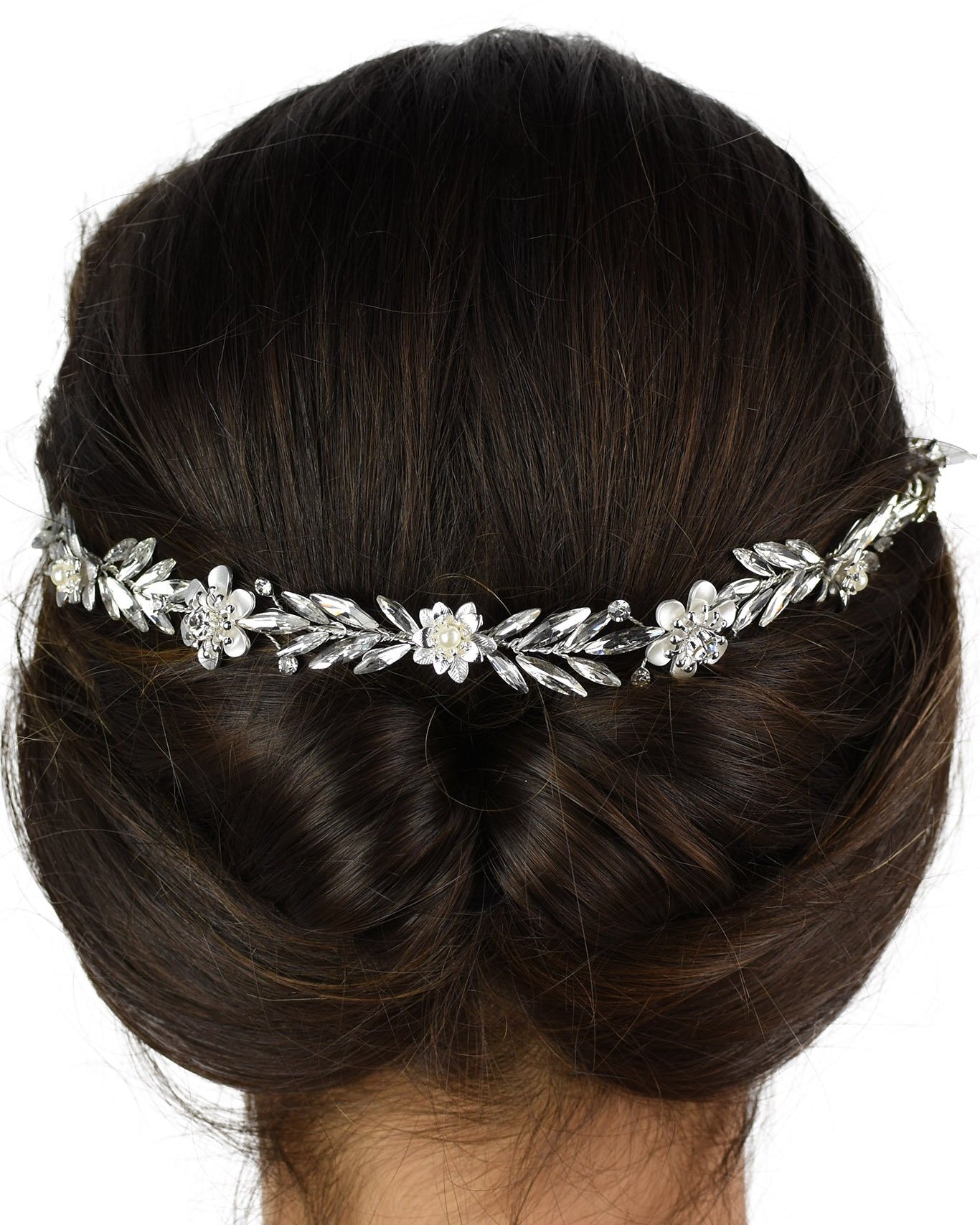 Back of a dark models head who is wearing a simple single strand Bridal Vine with a white background