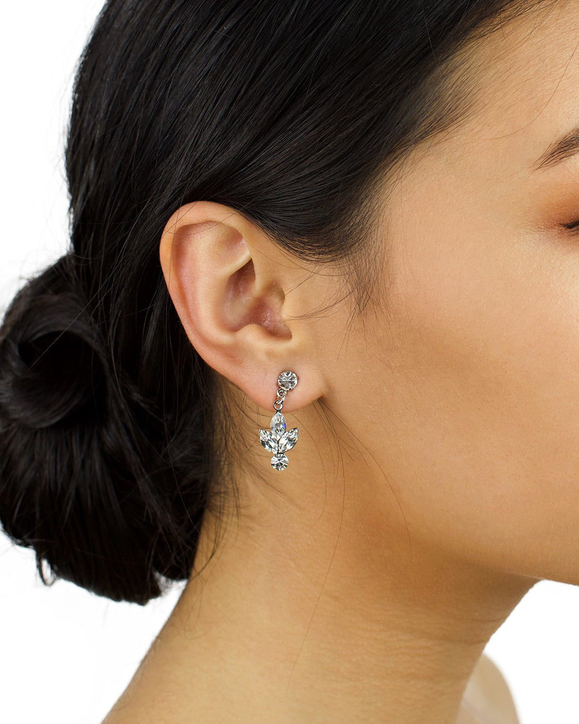 Small handmade Swarovski Earring worn by a bride with up style hair