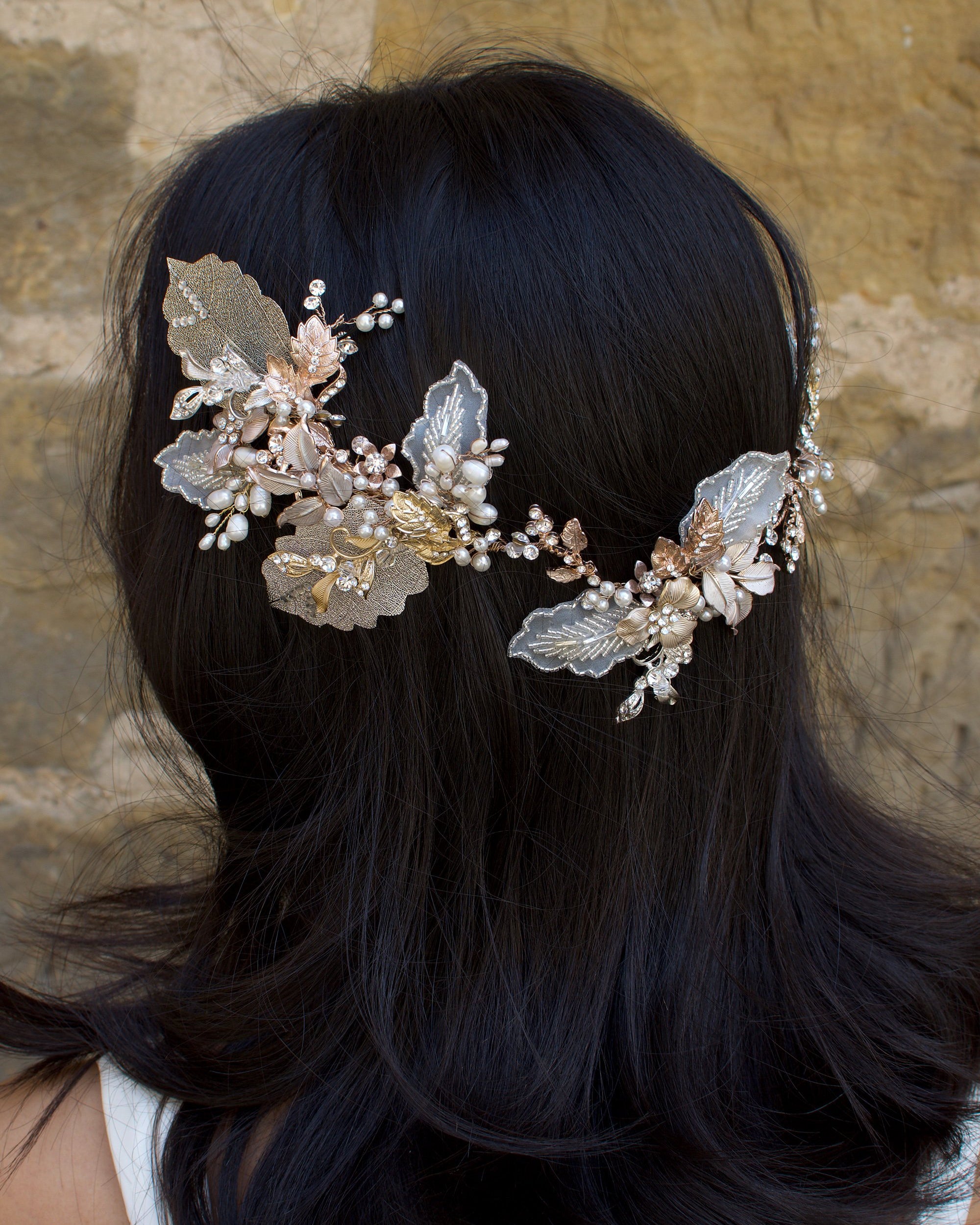 A dark haired model with hair down wears a Bridal Vine in Silver, Gold and Rose Gold