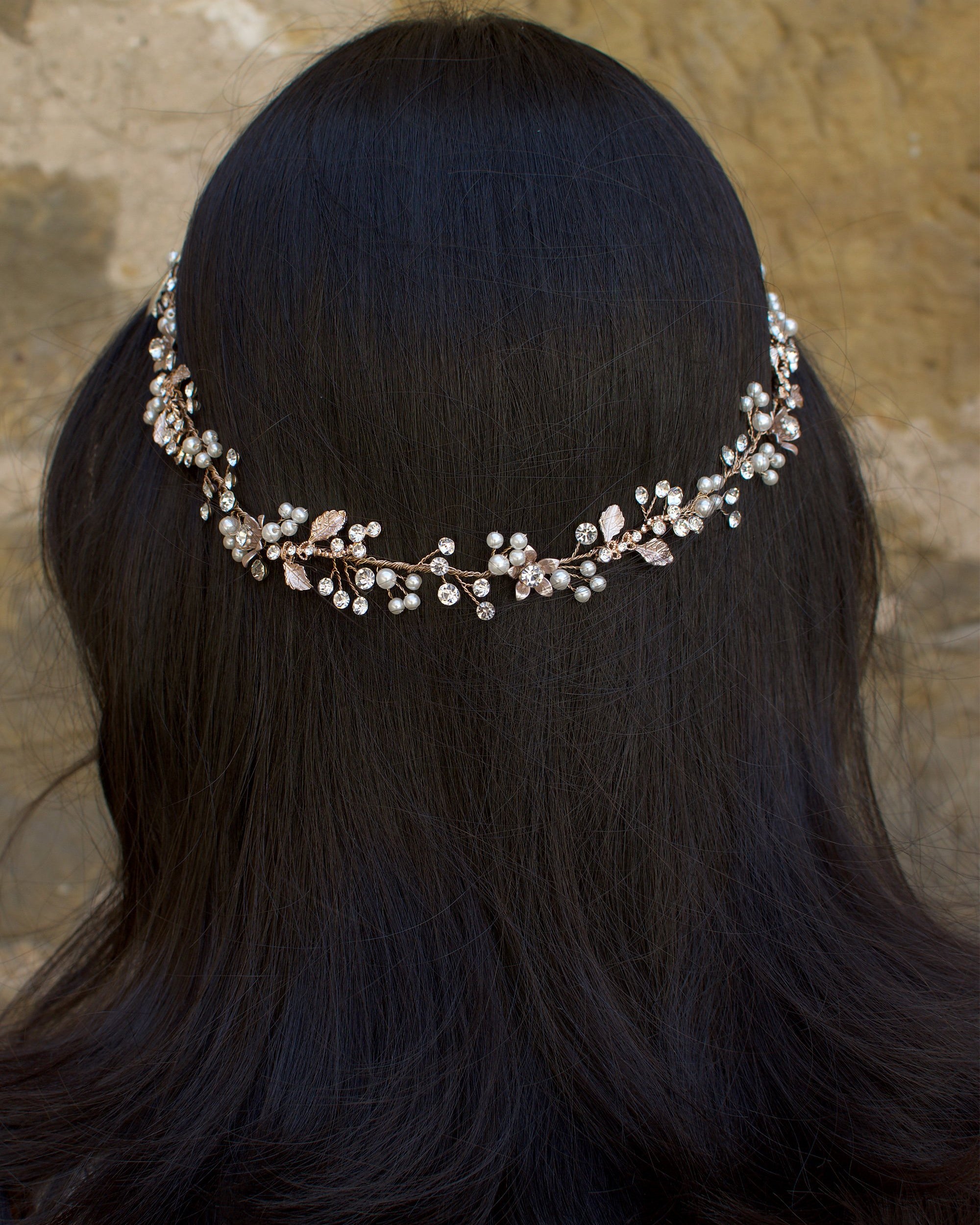 Rose Gold Vine with crystals and pearls on the back of the head of a dark hair model
