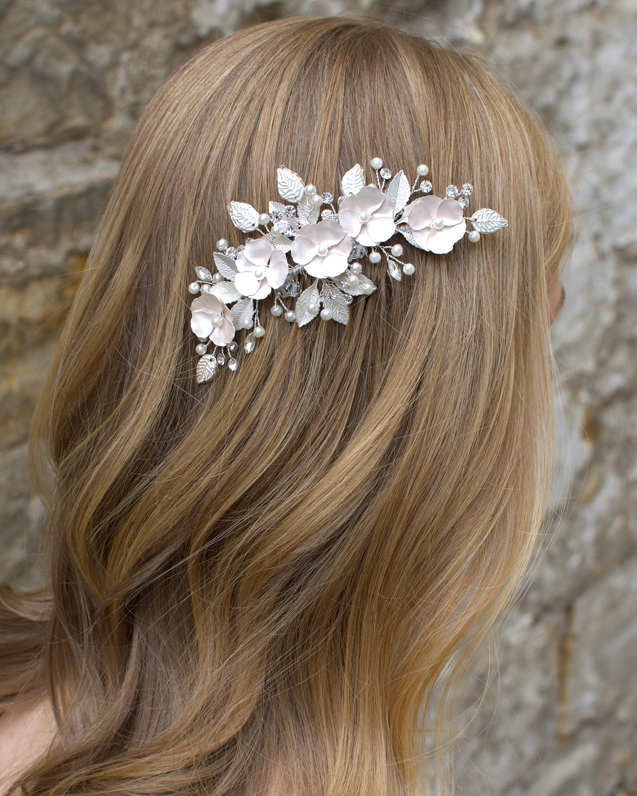 Pale Pink flower side comb worn by a blonde model bride