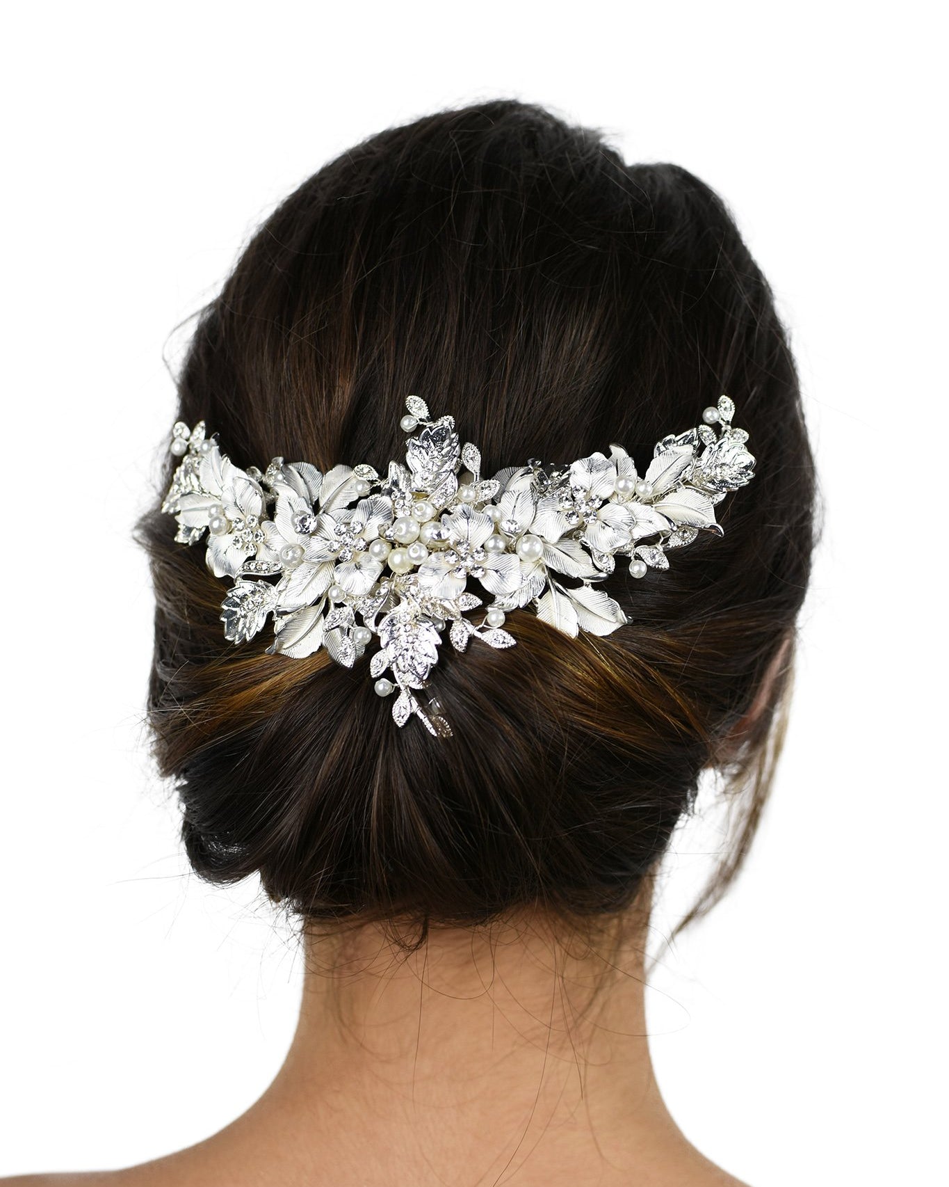 Silver leaves wide headpiece with pearls worn on the back of a dark hair model with a white background