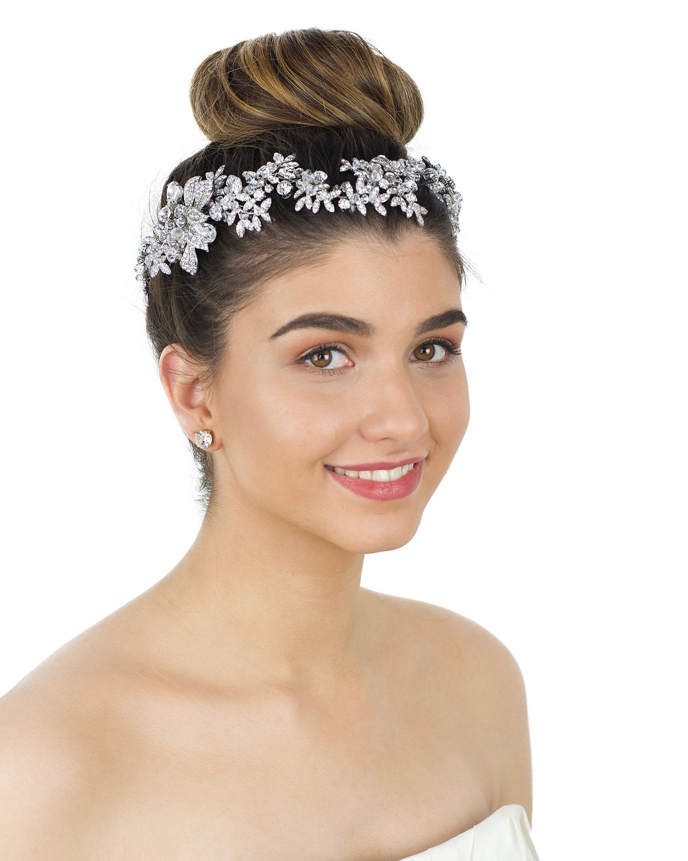 Long Bridal Vine worn by a smiling Bride on her brown hair with a white backdrop