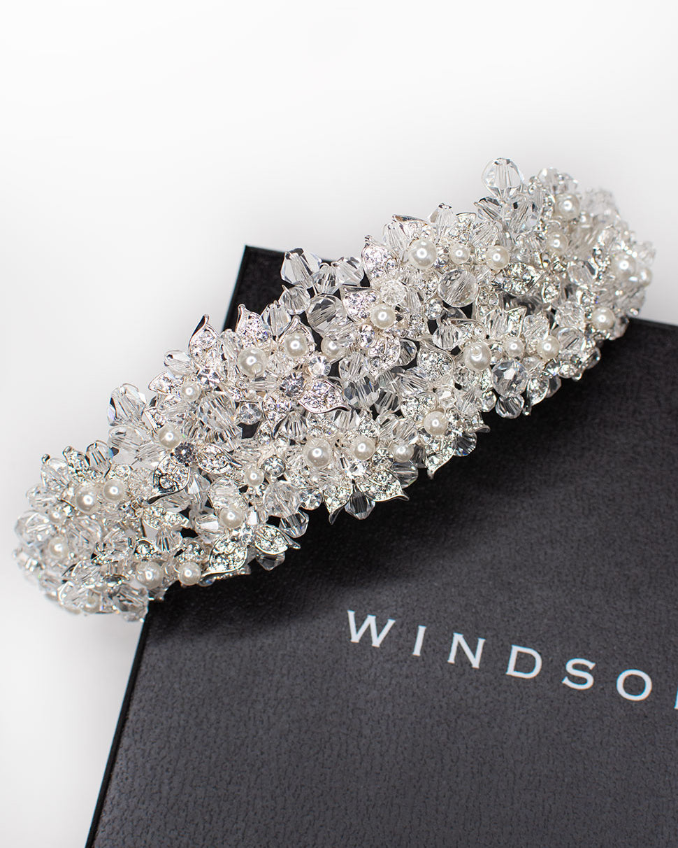 a double row silver bridal tiara on a black display box
