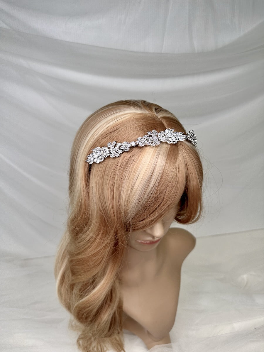 A thin style narrow bridal headband Loxley silver shown on a model head