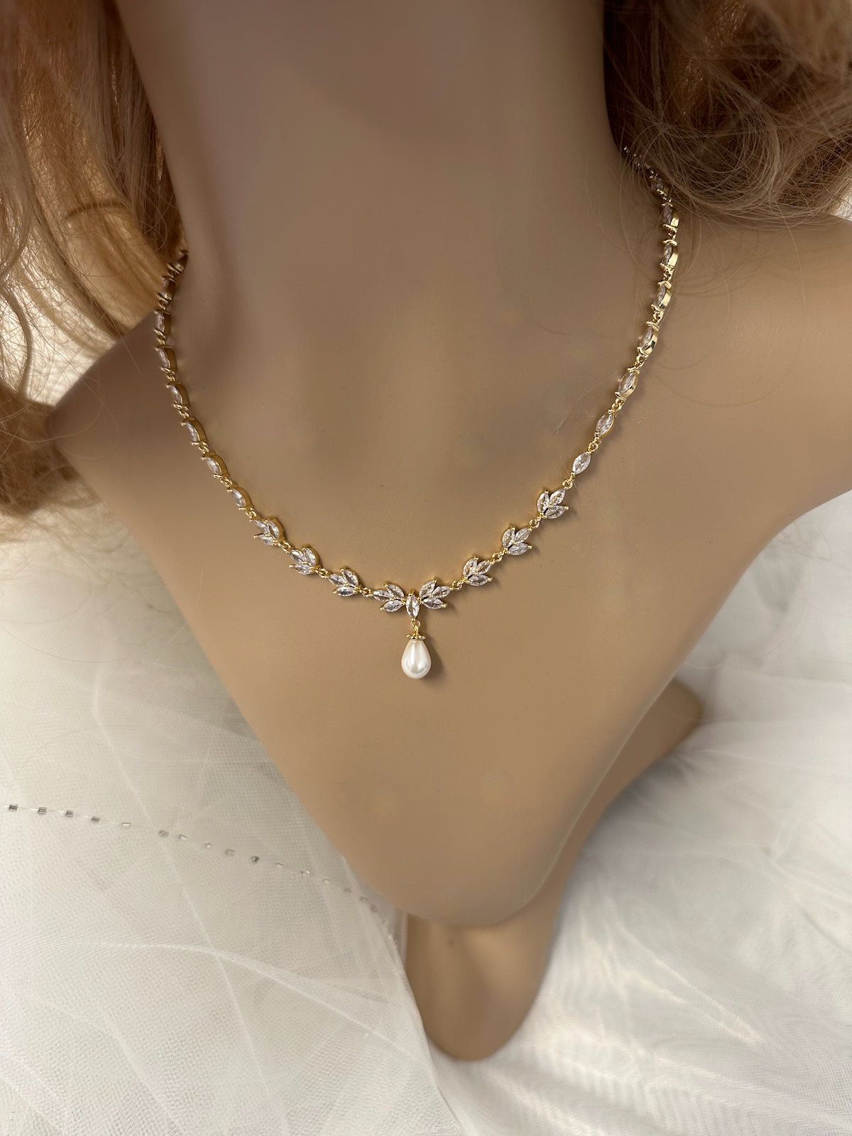 See the Leah Gold Necklace a beautiful pale gold bridal necklace on a model neck