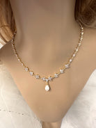 Lovely Leah Gold Necklace a beautiful pale gold bridal necklace on a model neck