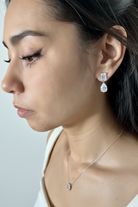 Ada White Gold Bridal Earring - rear three-quarter view on model